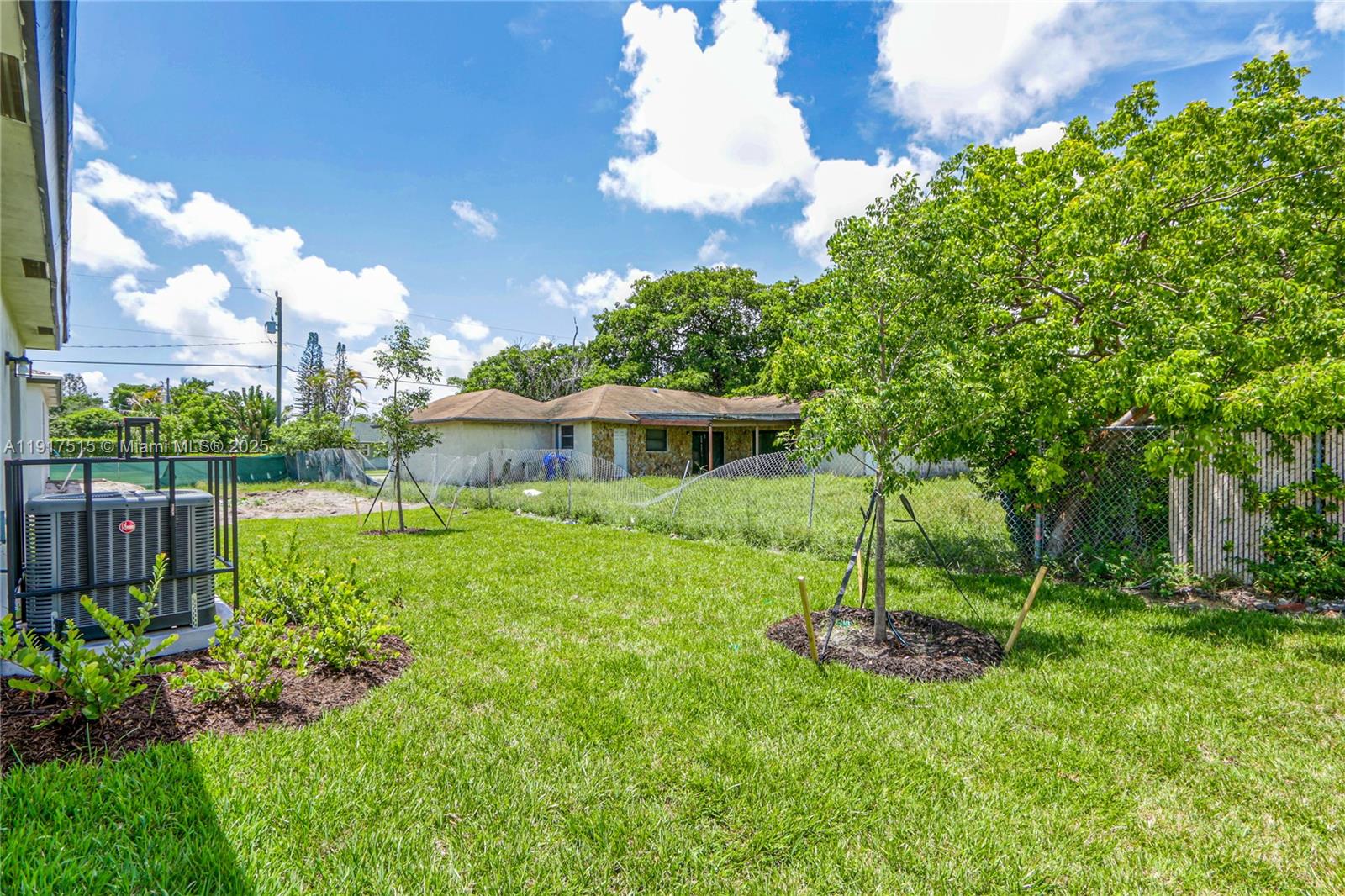 981 Northwest 4th Avenue, Unit 1 Pompano Beach, FL 33060 - Photo 5 of 12 a view of a house with a yard and a garden