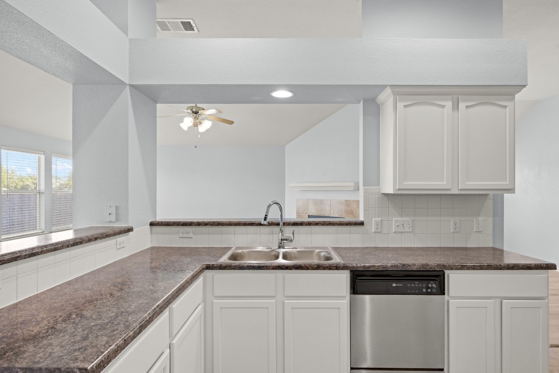 1323 Anna Palm Way Round Rock, TX 78665 - Photo 13 of 29 a kitchen with granite countertop a sink and cabinets