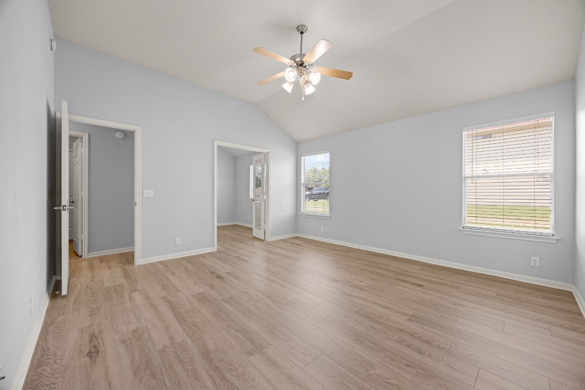 1323 Anna Palm Way Round Rock, TX 78665 - Photo 15 of 29 a view of an empty room with wooden floor and a window
