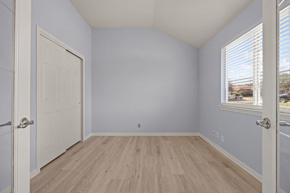 1323 Anna Palm Way Round Rock, TX 78665 - Photo 16 of 29 an empty room with a closet and a window