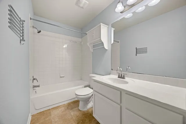 a bathroom with a sink a toilet and a bathtub