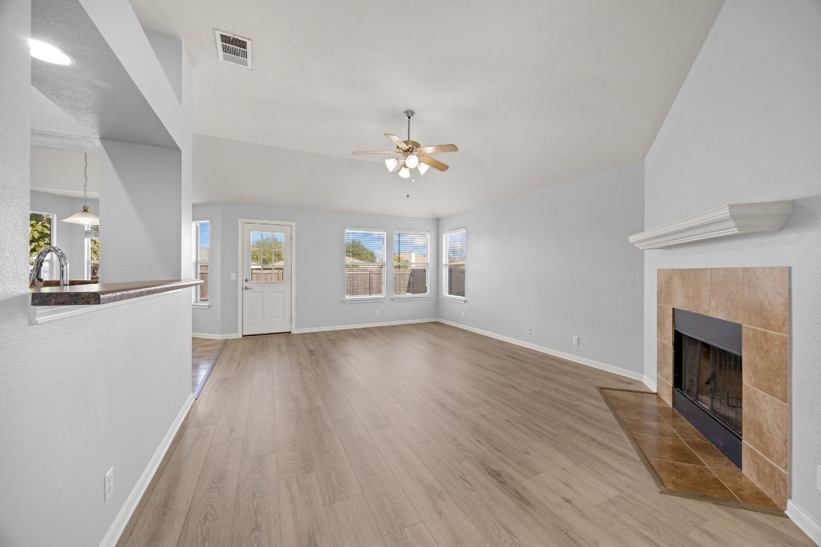 1323 Anna Palm Way Round Rock, TX 78665 - Photo 6 of 29 an empty room with windows and fireplace