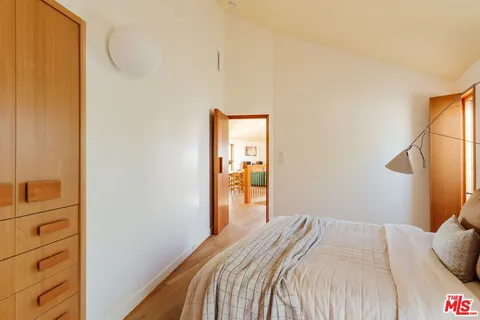 a bedroom with a bed and a closet