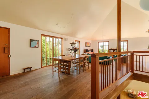 an outdoor space with furniture window and wooden floor