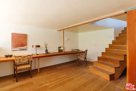 a view of workspace with wooden floor