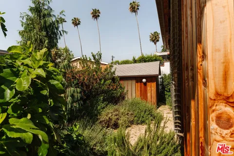 a view of a house with a tree