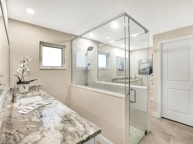 a bathroom with a bathtub and shower