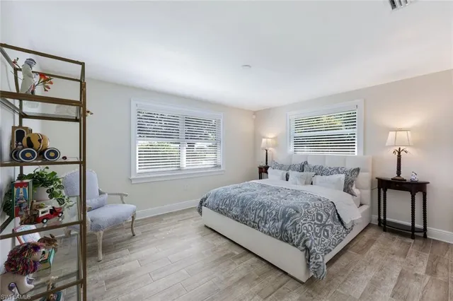 a bedroom with a bed and a couch