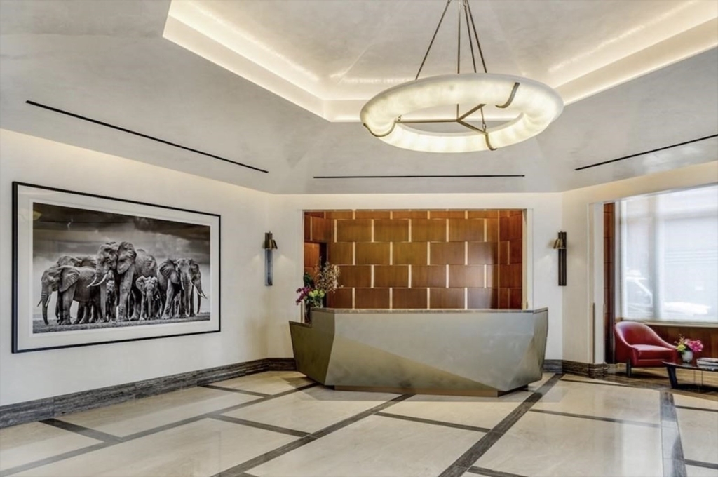 100 Lovejoy Wharf, Unit 8C Boston, MA 02114 - Photo 8 of 9 a view of a living room and a window
