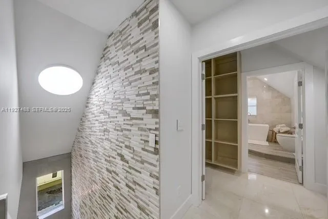 a bathroom with a shower and a sink