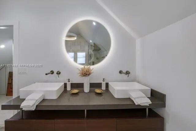 a view of a dining room with furniture and a mirror