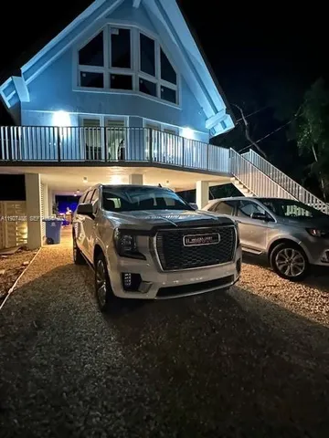 a view of a porch with furniture and yard
