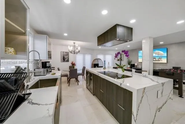 a kitchen with sink a stove and cabinets
