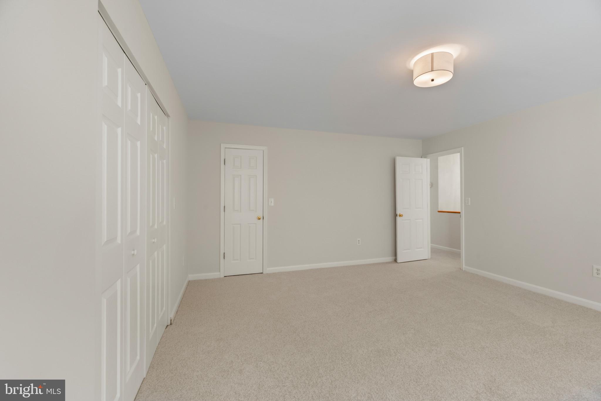 5929 Deale Beach Road Deale, MD 20751 - Photo 39 of 58 Unfurnished bedroom featuring light carpet and a c