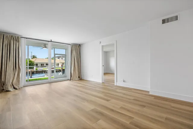 a spacious bathroom with a double vanity sink mirror and toilet