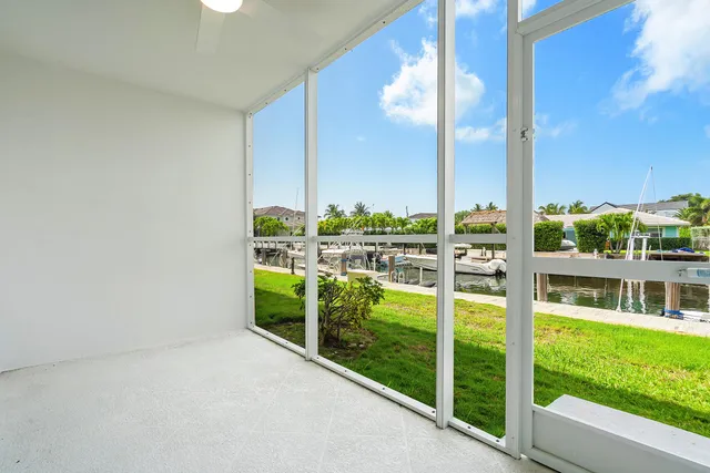 a view of a backyard with plants and patio