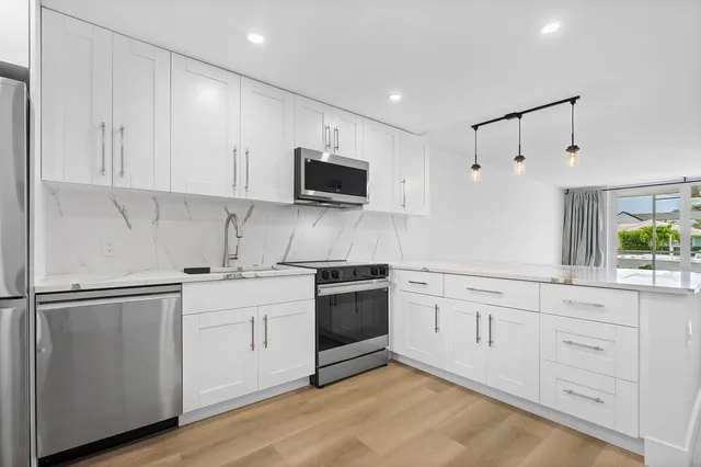 a view of a livingroom with wooden floor