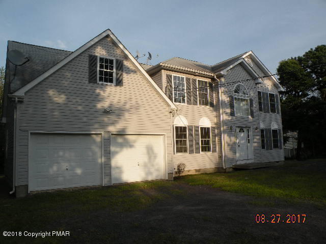 1604 Clover Road Long Pond, PA 18334 - Photo 1 of 18 a front view of a house with a garden