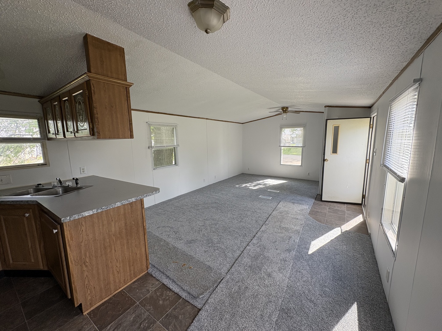 2003 Maple Acres Drive Princeton, IL 61356 - Photo 4 of 14 a view of a kitchen with a sink cabinets and a window