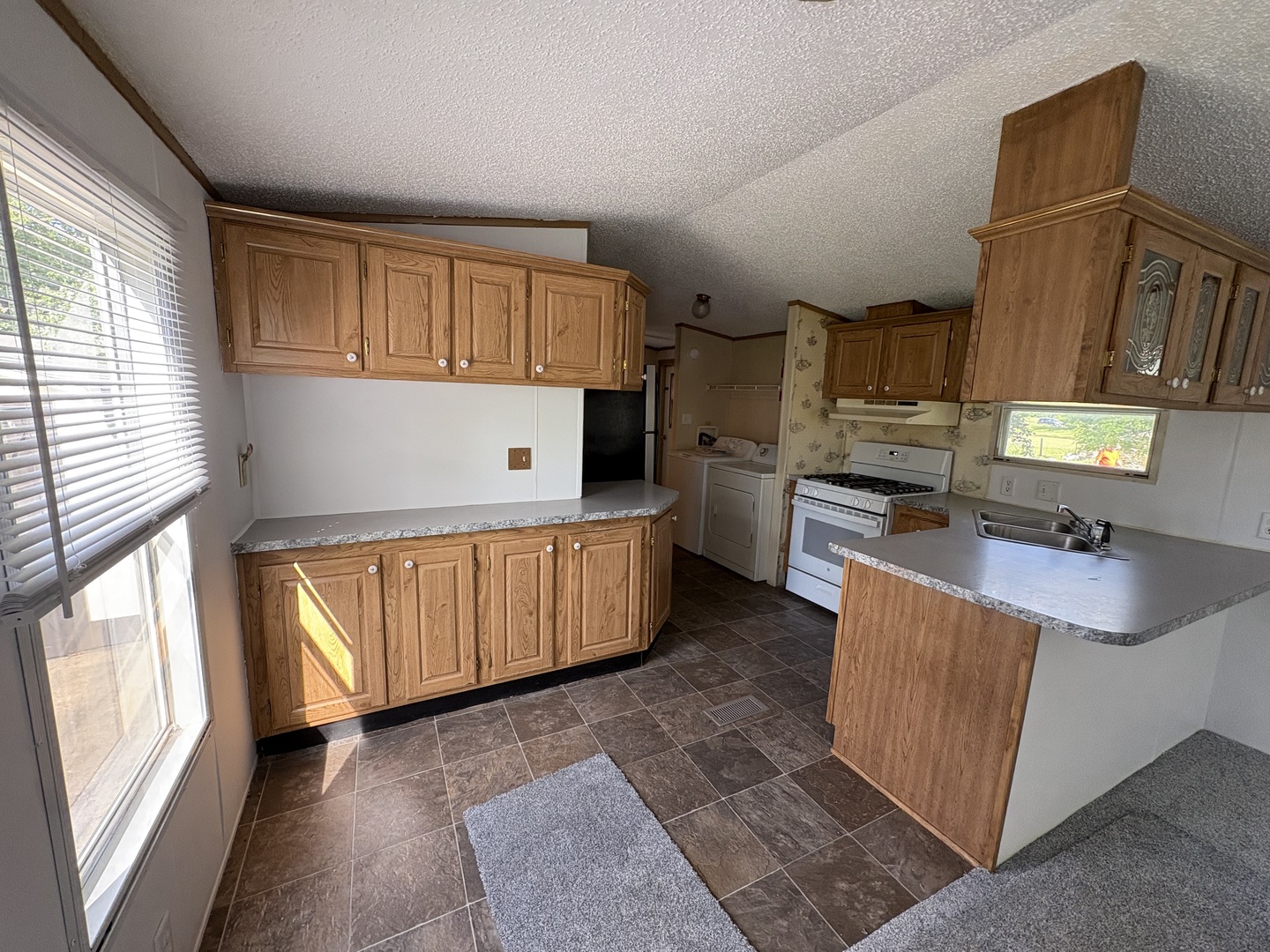 2003 Maple Acres Drive Princeton, IL 61356 - Photo 6 of 14 a kitchen with stainless steel appliances granite countertop a stove a sink and a refrigerator