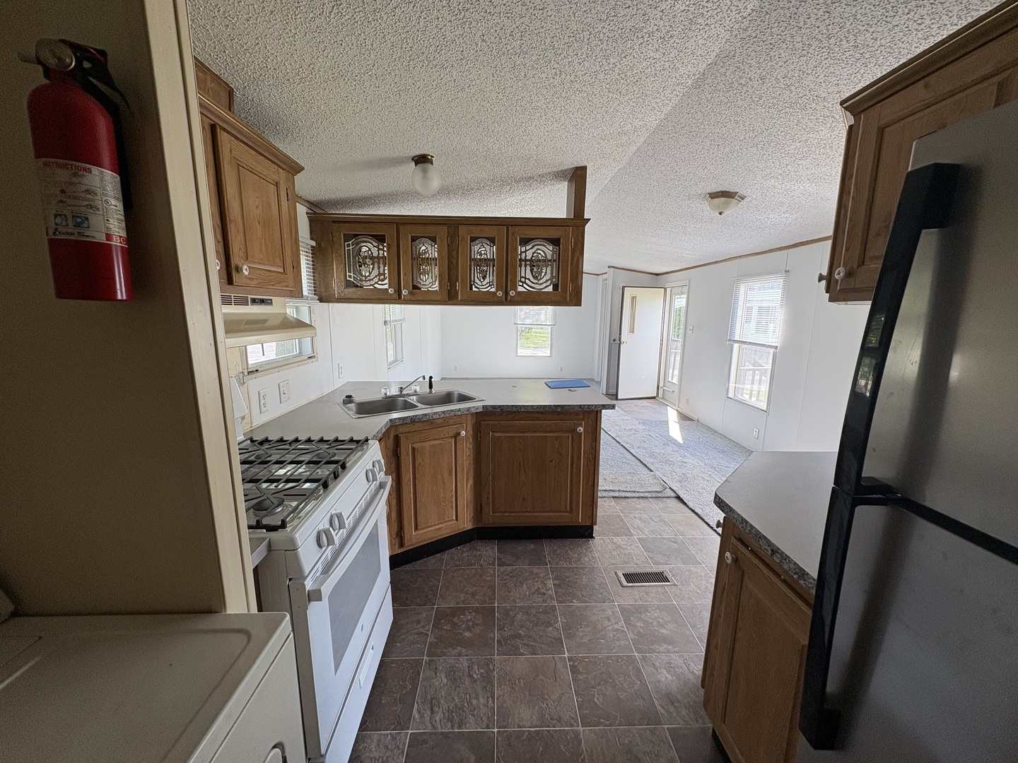 2003 Maple Acres Drive Princeton, IL 61356 - Photo 7 of 14 a kitchen with stainless steel appliances granite countertop a stove a sink and a refrigerator