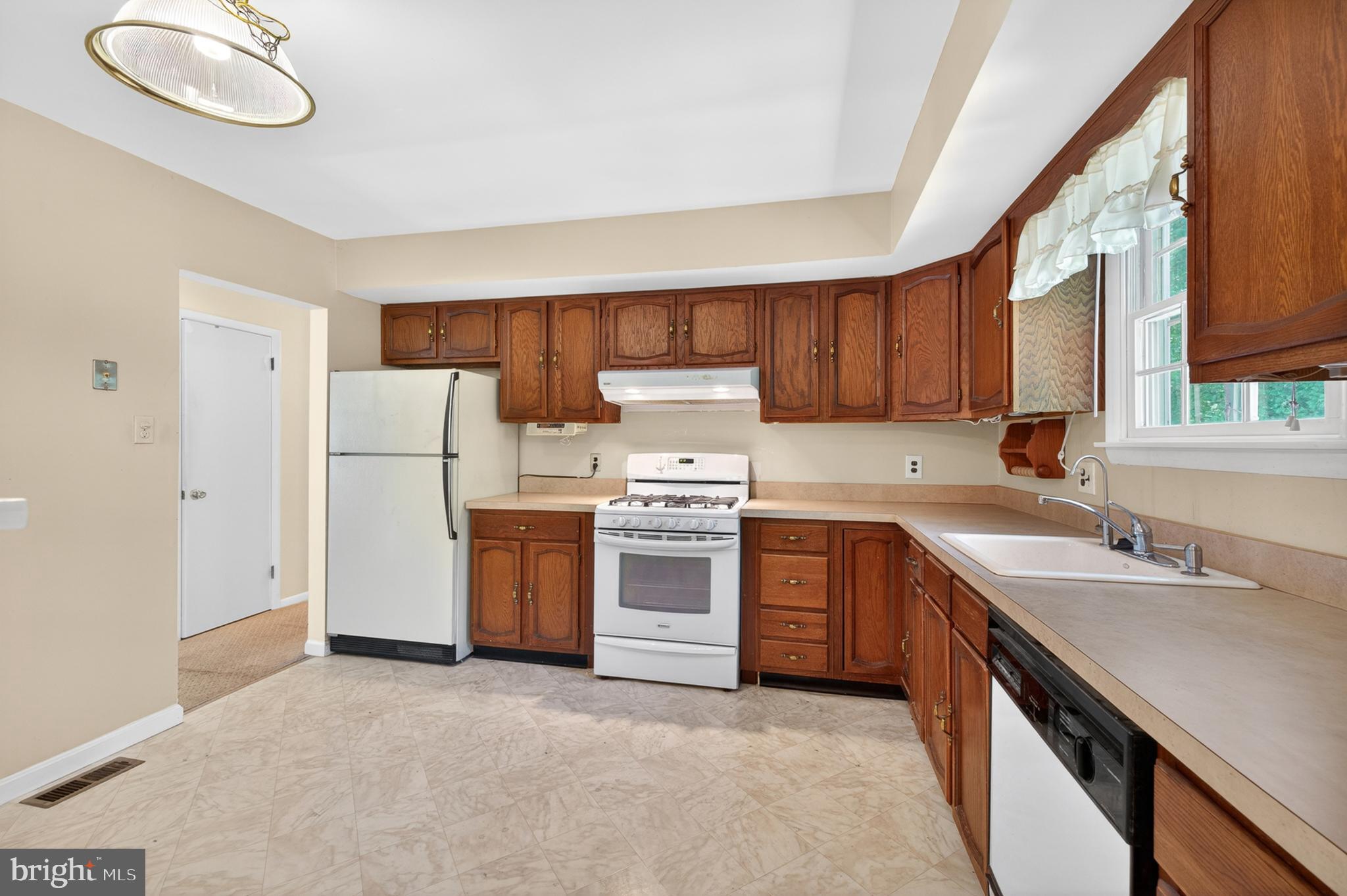 3701 Ebright Road Chadds Ford, PA 19317 - Photo 18 of 45 a kitchen with a sink cabinets stainless steel appliances and a window