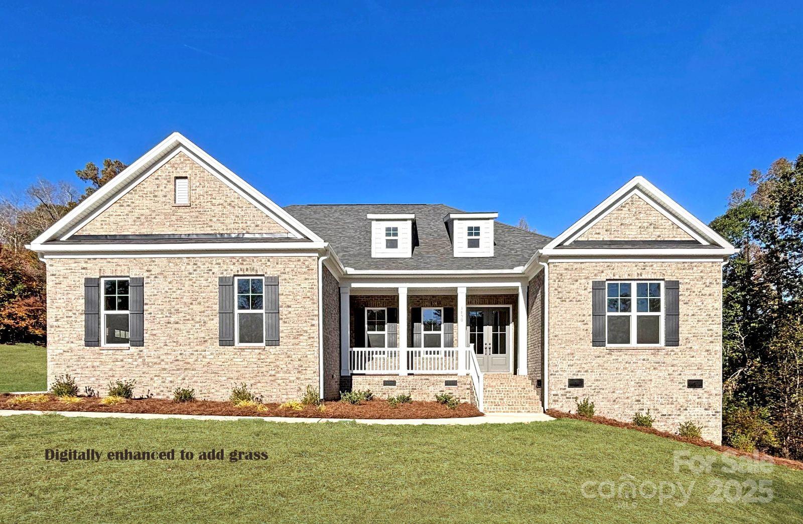 3850 Willow Grove Lane, Unit 24 Concord, NC 28025 - Photo 1 of 40 a front view of a house with a yard