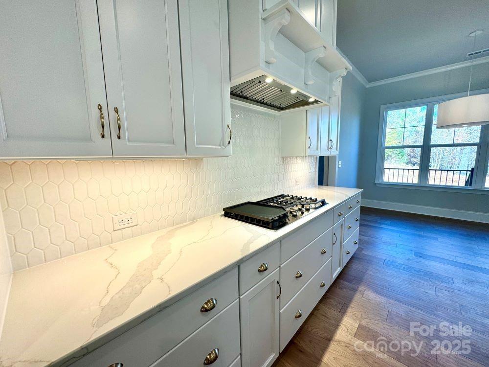 3850 Willow Grove Lane, Unit 24 Concord, NC 28025 - Photo 12 of 40 a kitchen with stainless steel appliances a stove a sink and a refrigerator