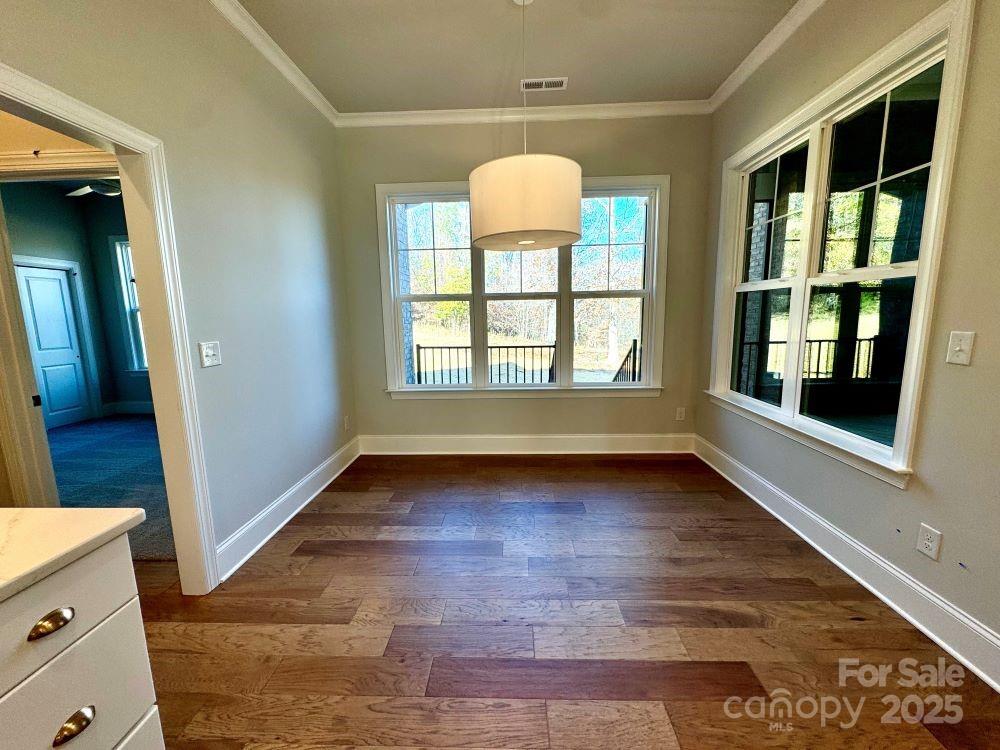 3850 Willow Grove Lane, Unit 24 Concord, NC 28025 - Photo 17 of 40 wooden floor in an empty room with a window