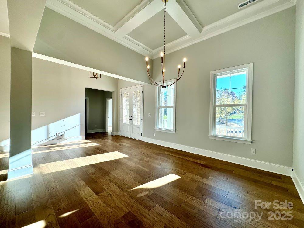 3850 Willow Grove Lane, Unit 24 Concord, NC 28025 - Photo 20 of 40 a view of an empty room with window and wooden floor
