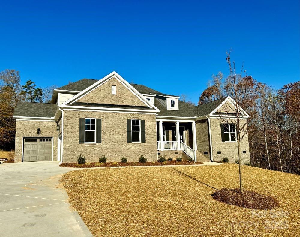 3850 Willow Grove Lane, Unit 24 Concord, NC 28025 - Photo 2 of 40 a front view of a house with a yard