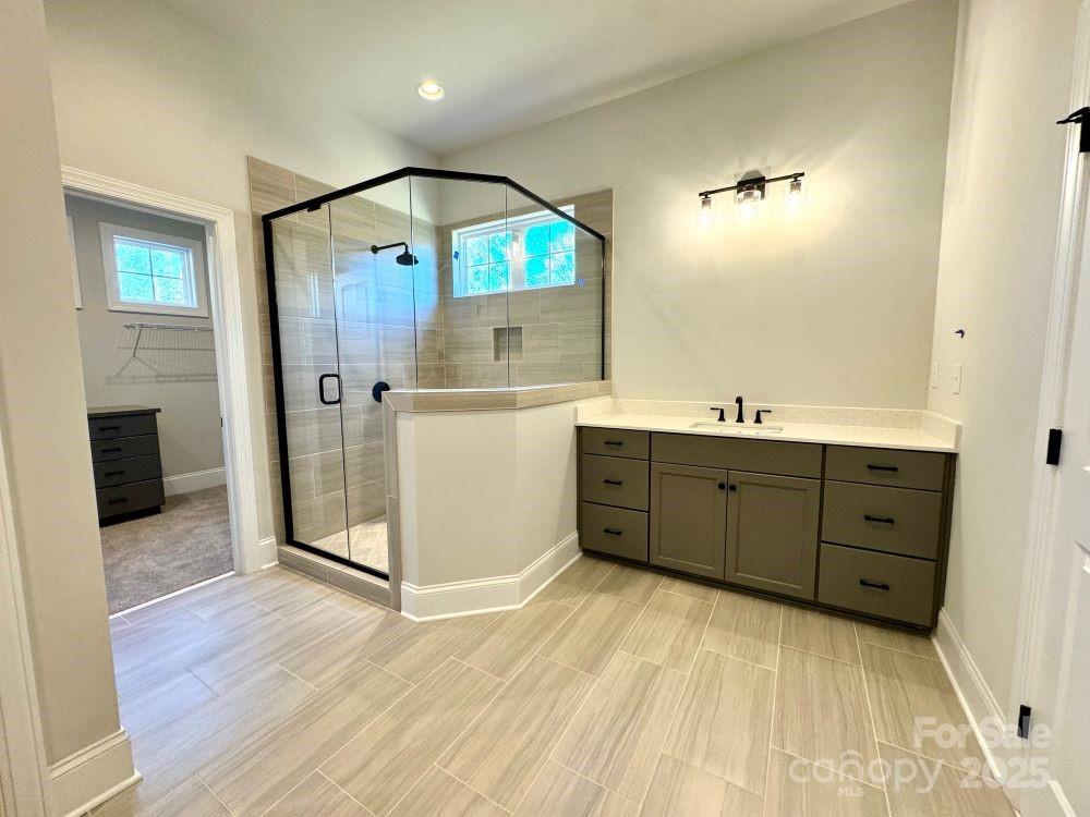 3850 Willow Grove Lane, Unit 24 Concord, NC 28025 - Photo 27 of 40 a room with a dresser and a mirror