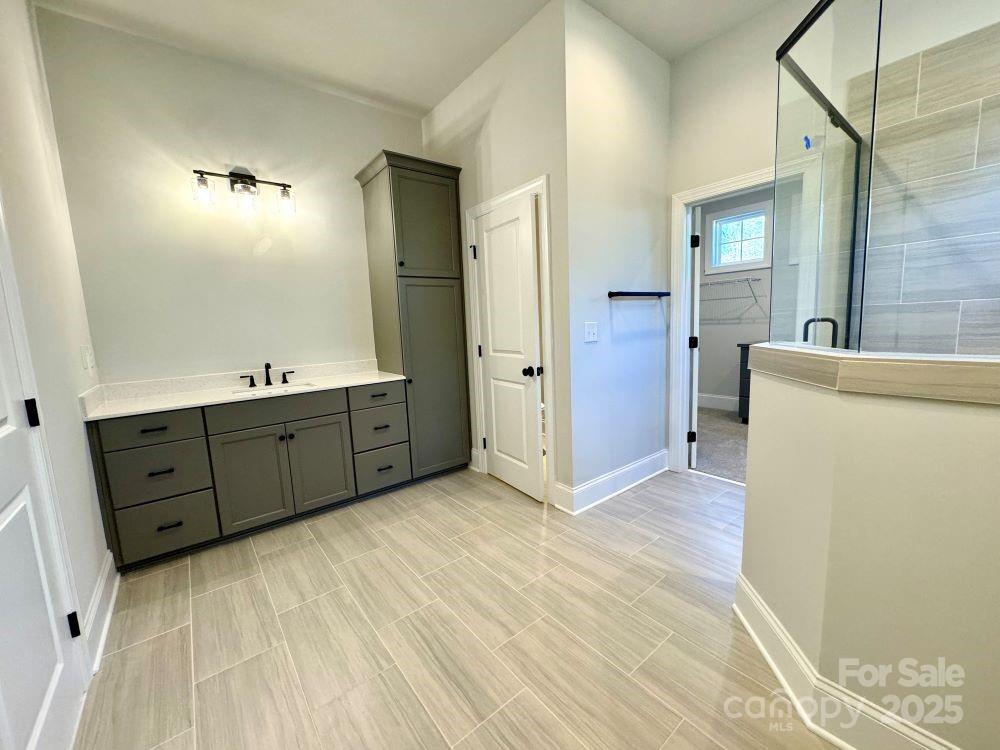 3850 Willow Grove Lane, Unit 24 Concord, NC 28025 - Photo 29 of 40 a room with a dresser and a mirror