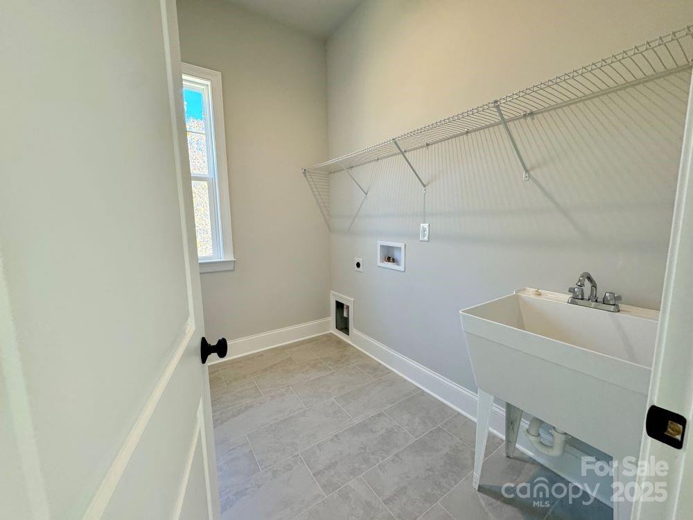 3850 Willow Grove Lane, Unit 24 Concord, NC 28025 - Photo 35 of 40 a bathroom with a sink and shower