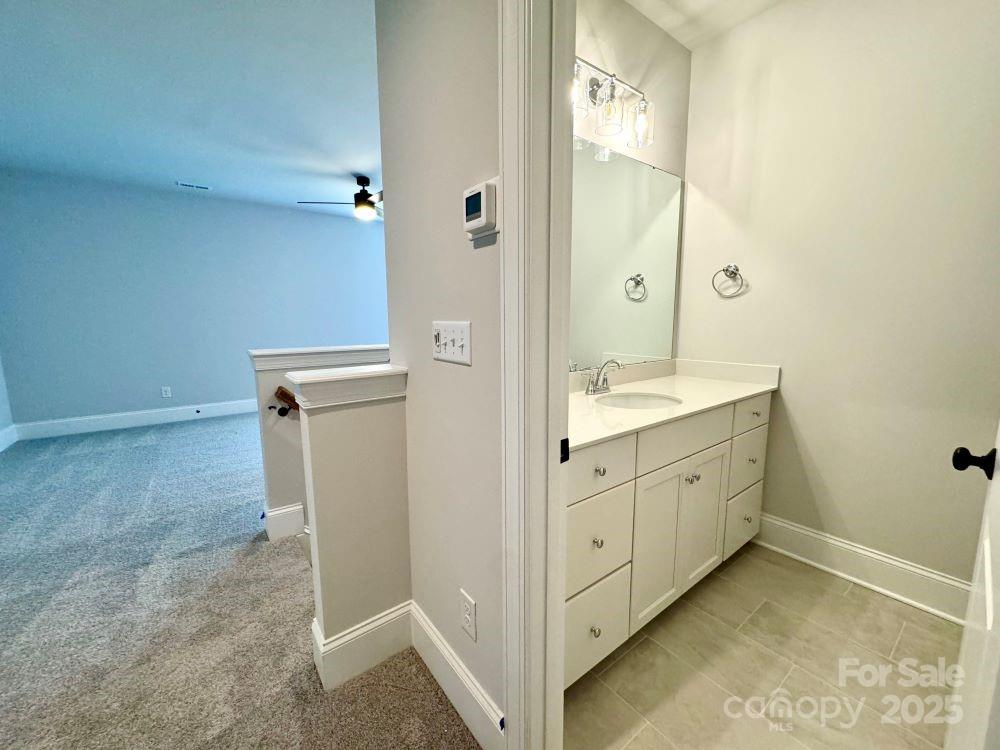 3850 Willow Grove Lane, Unit 24 Concord, NC 28025 - Photo 38 of 40 a spacious bathroom with a double vanity sink a mirror and a