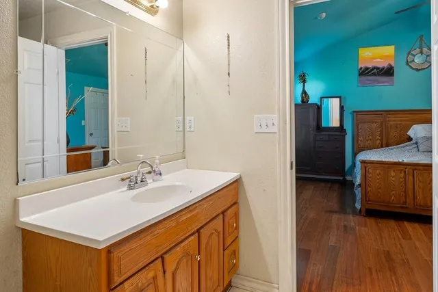 a bathroom with a sink and a mirror