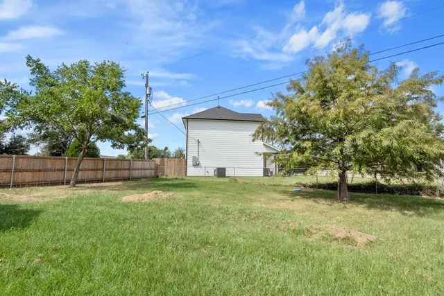 a backyard of a house with lots of green space