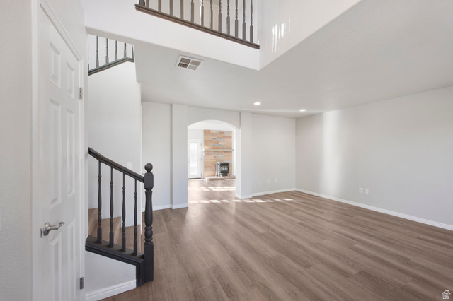 1440 West 100 South Virgin, UT 84779 - Photo 9 of 45 Spacious living area featuring wood-finish flooring, recessed lighting, and a two-story ceiling