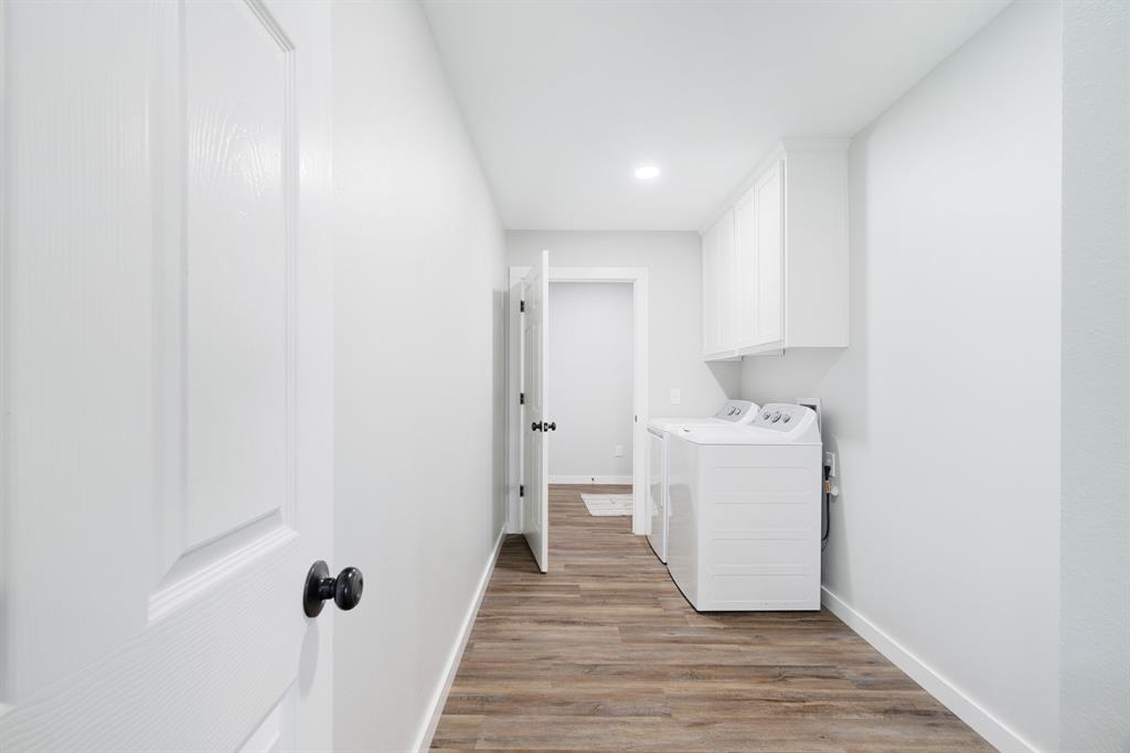 19 Private Road Paris, TX 75460 - Photo 14 of 18 a view of a storage & utility room with a washer dryer