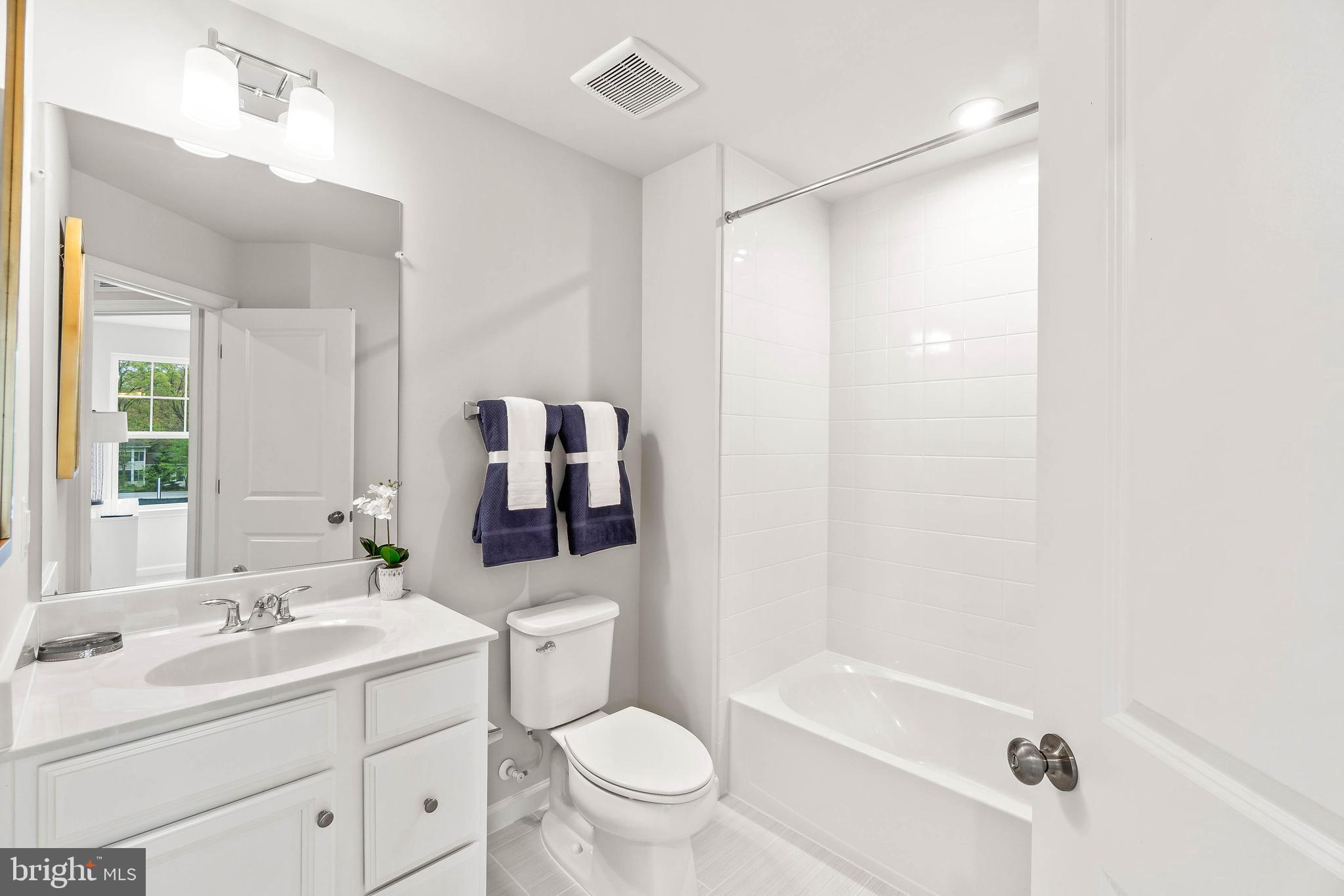 7109 Gladebrook Road Brandywine, MD 20613 - Photo 12 of 26 a bathroom with a sink a toilet and shower