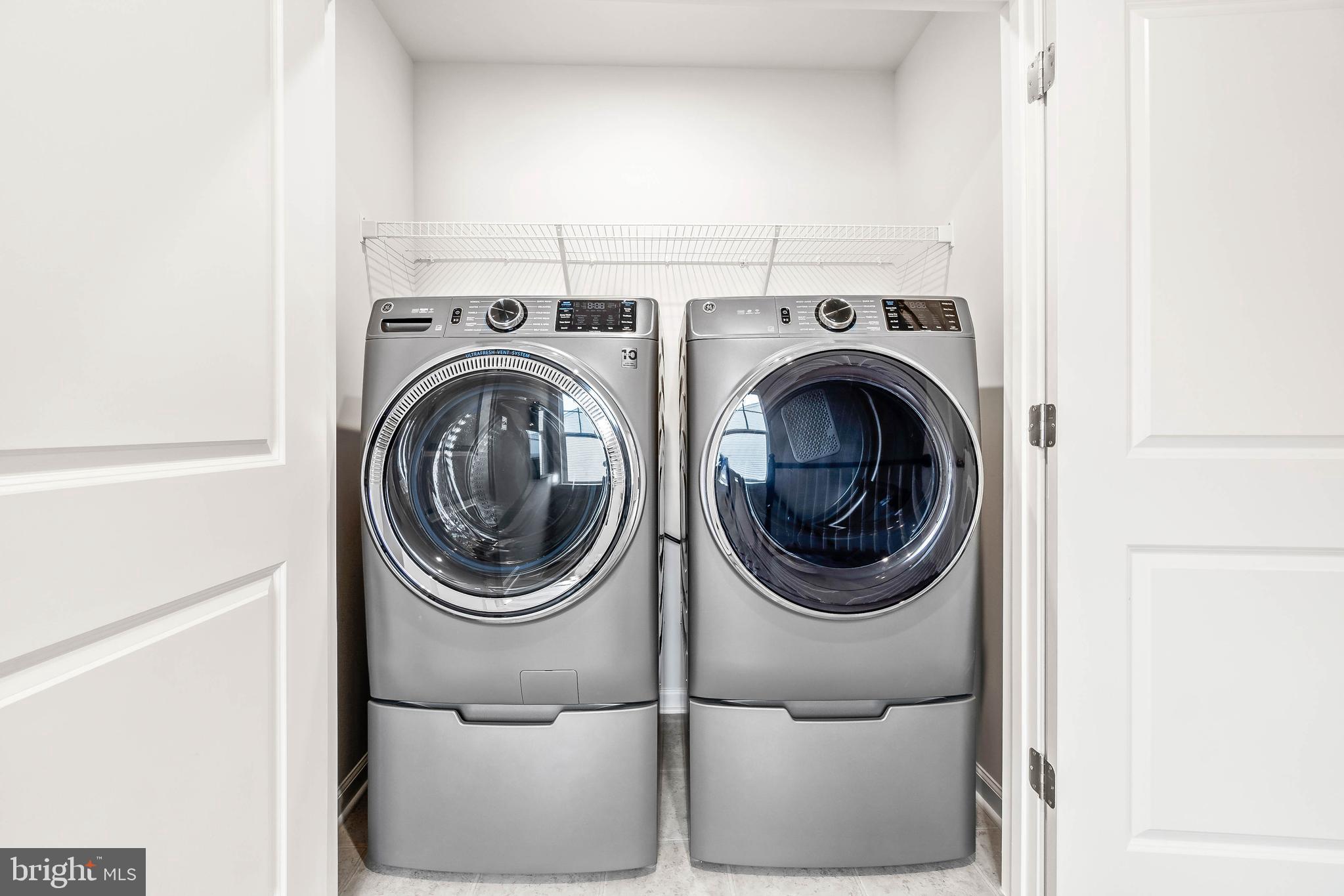 7109 Gladebrook Road Brandywine, MD 20613 - Photo 13 of 26 a utility room with dryer and washer