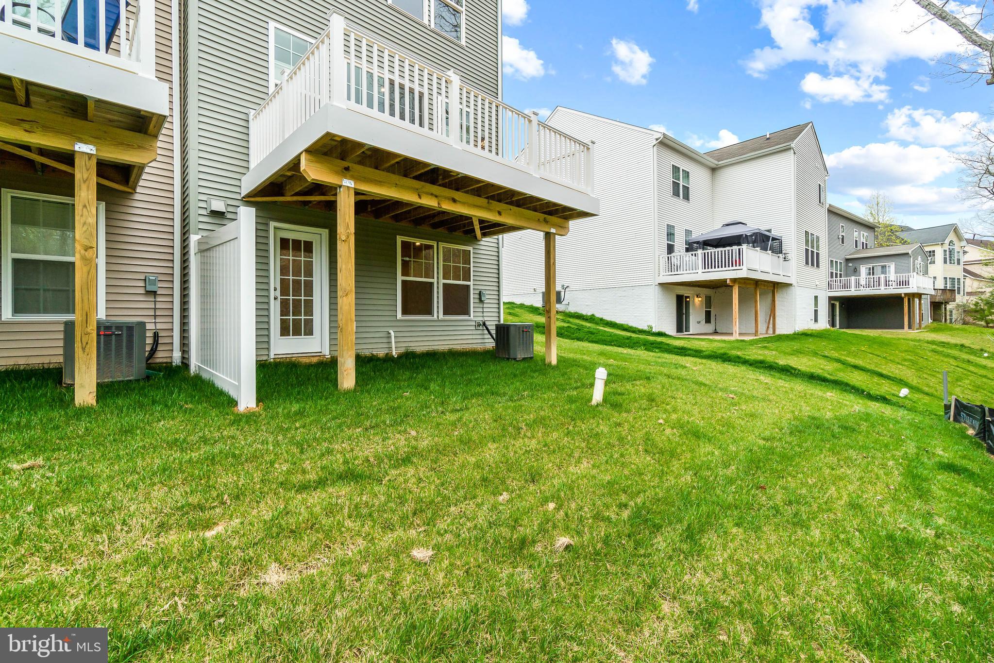 7109 Gladebrook Road Brandywine, MD 20613 - Photo 19 of 26 a view of a house with a yard