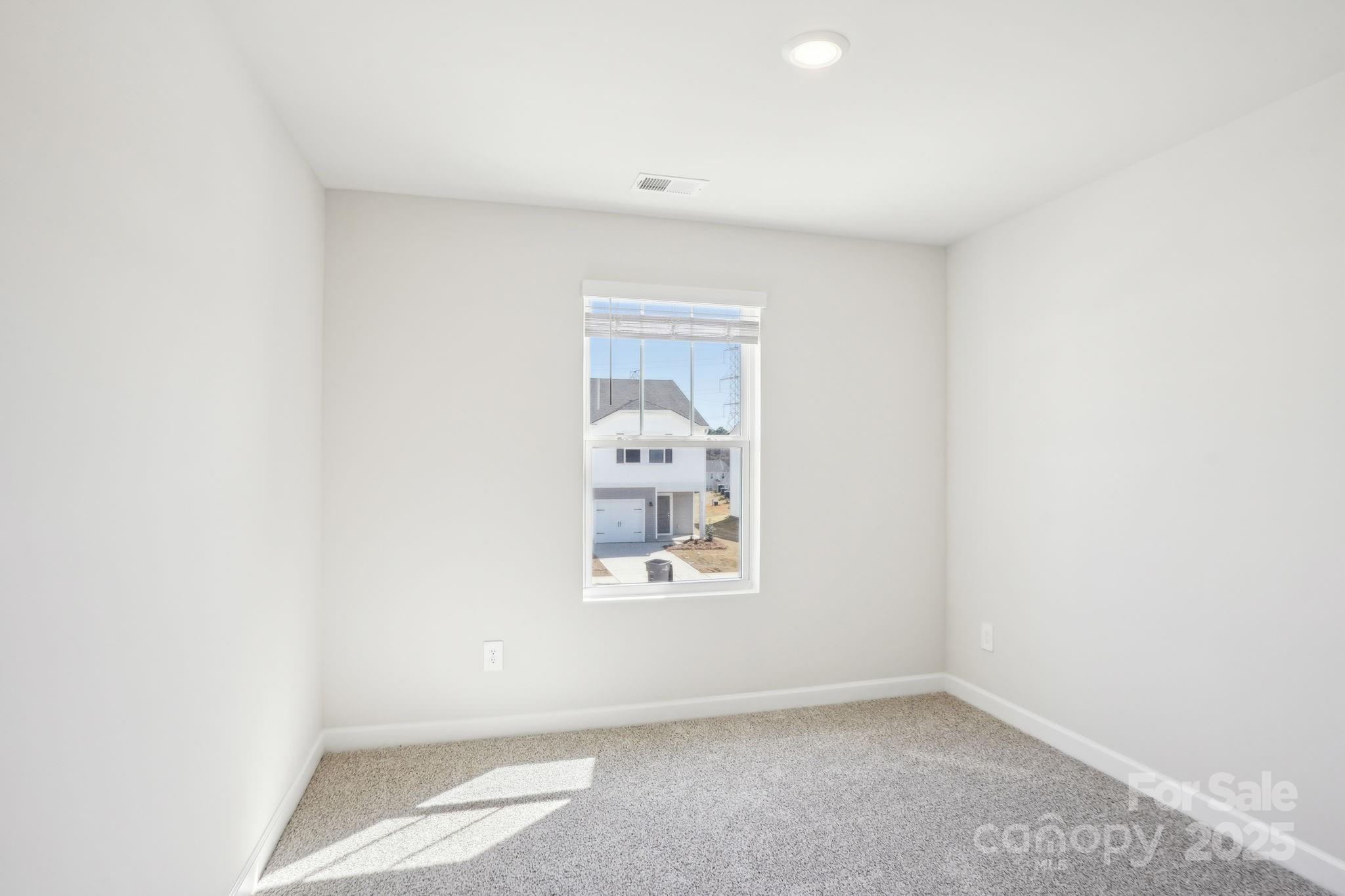 1413 Old Rivers Road Concord, NC 28027 - Photo 10 of 20 a view of an empty room with a window