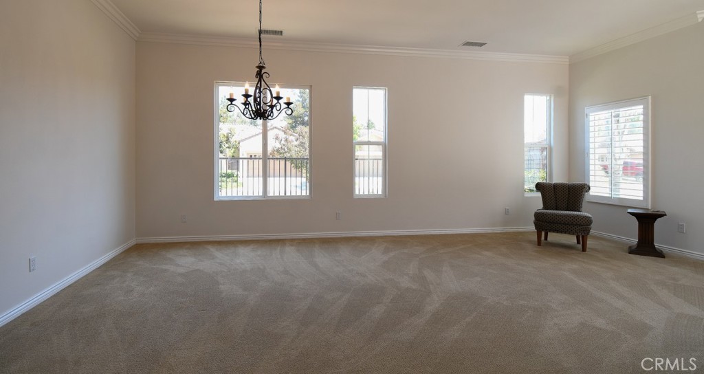 9152 Deergrass Street Corona, CA 92883 - Photo 14 of 32 a view of an empty room with a window