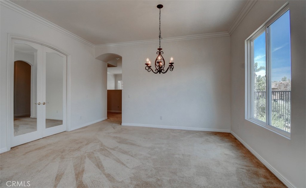 9152 Deergrass Street Corona, CA 92883 - Photo 15 of 32 a view of a room with a chandelier