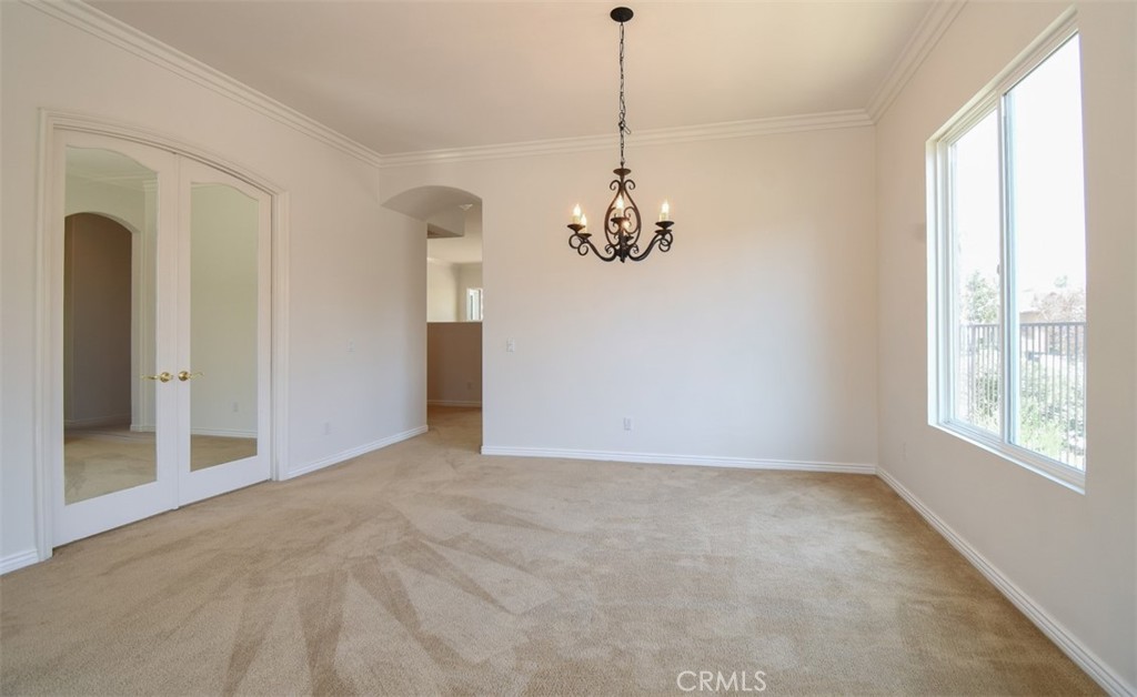 9152 Deergrass Street Corona, CA 92883 - Photo 16 of 32 a view of an empty room with a window
