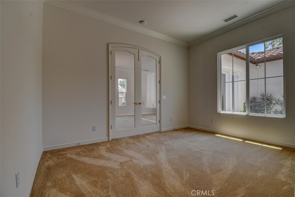 9152 Deergrass Street Corona, CA 92883 - Photo 17 of 32 an empty room with windows