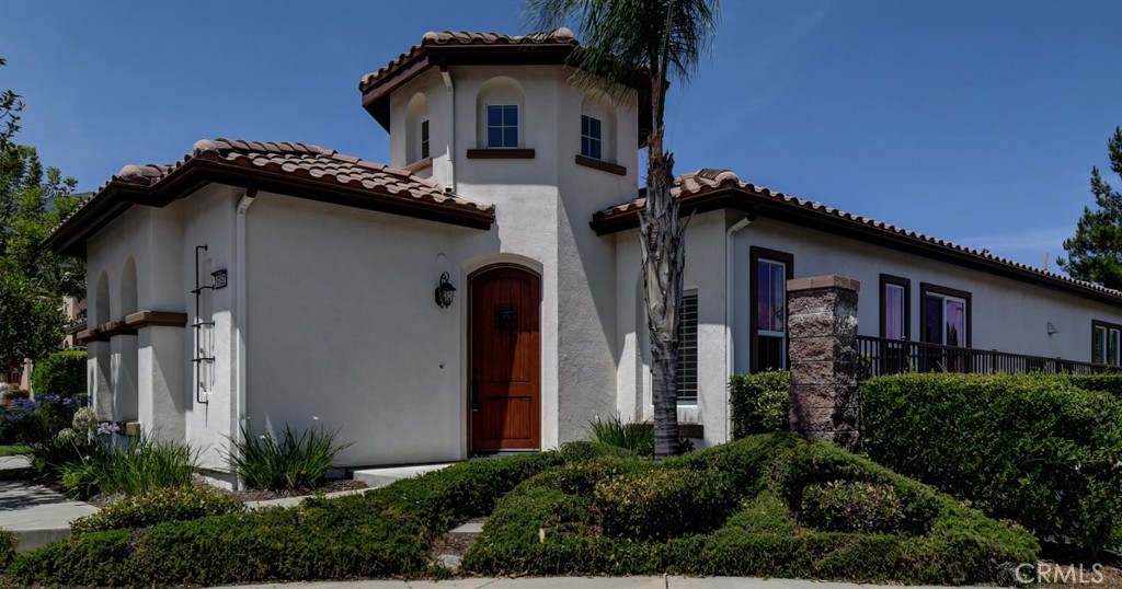 9152 Deergrass Street Corona, CA 92883 - Photo 2 of 32 a front view of a house with plants