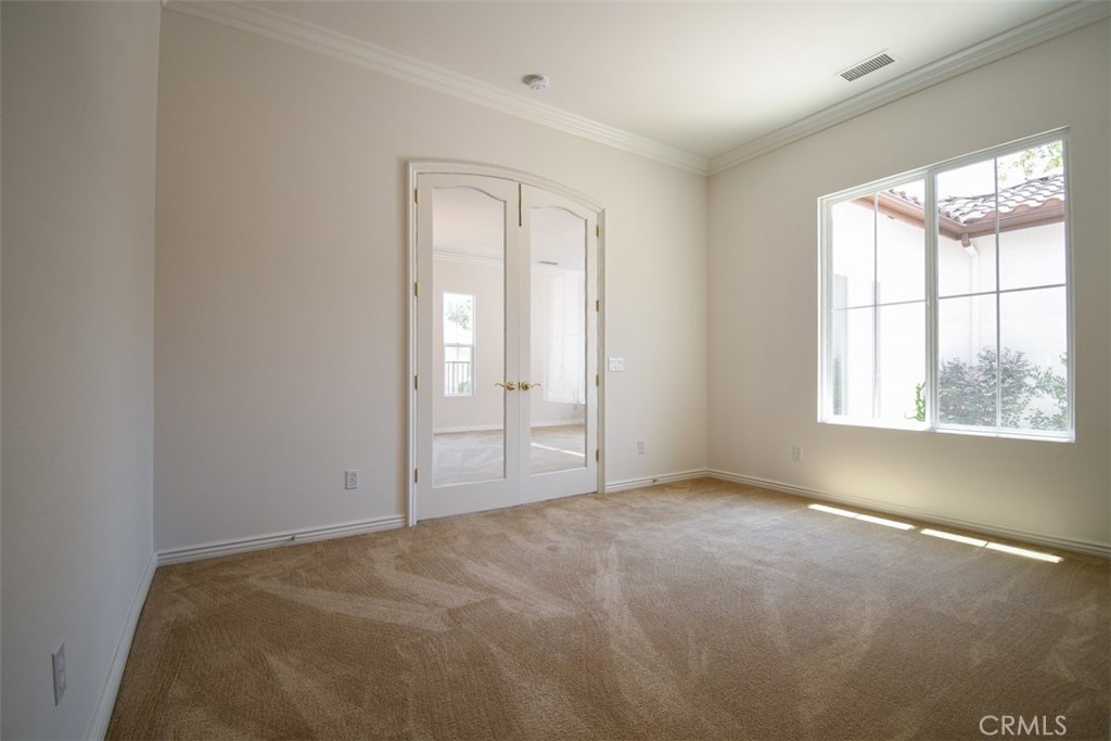 9152 Deergrass Street Corona, CA 92883 - Photo 23 of 32 an empty room with windows