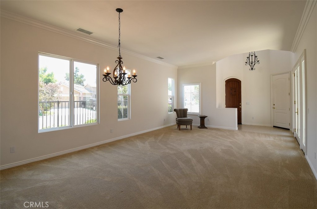 9152 Deergrass Street Corona, CA 92883 - Photo 5 of 32 a view of a room with window and chandelier